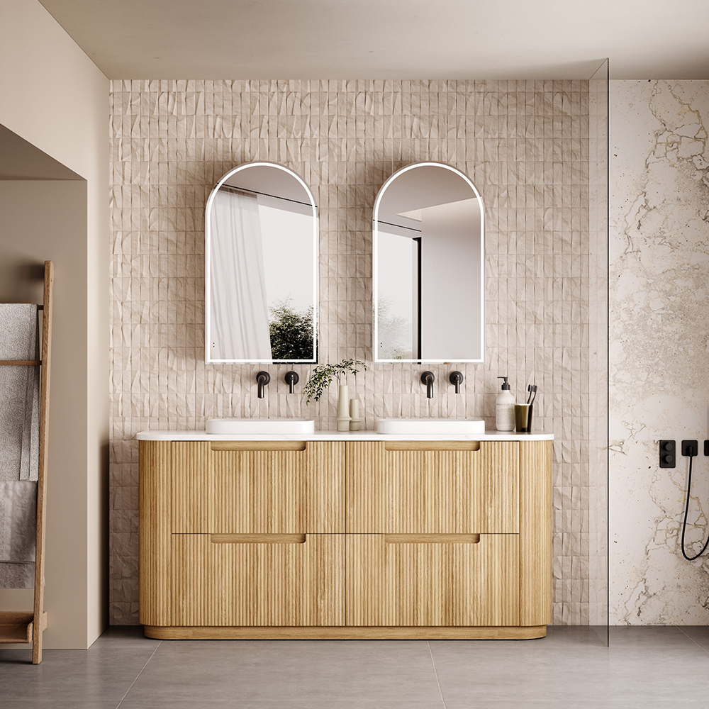 The Varcelli floor-standing vanity brings a perfect balance of warmth and sophistication to your bathroom. Crafted from premium timber plywood, it features beautifully curved edges and a natural wood finish that complements the serene, light-toned space. The vertical groove design adds texture and elegance, while the s